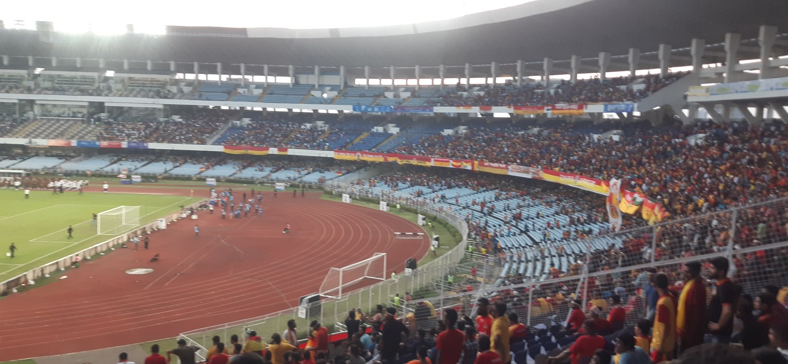 Football supporters cheering at Salt Lake Stadium, Kolkata